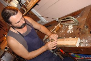 Image planing sides of Violin in Brisbane work shop