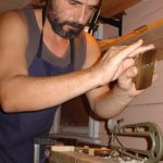 Master Violin maker at hos workbench